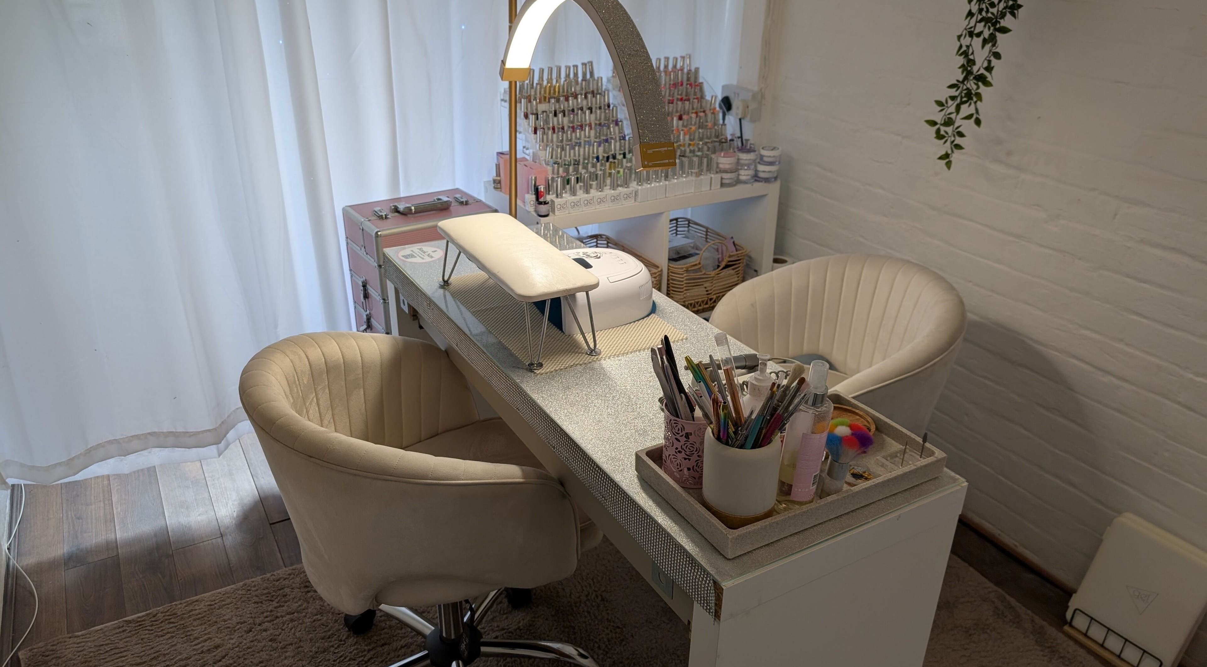 Stylish manicure station at Luxe Beauty by Rosie, Lowestoft, England, GB with tools and comfy chairs.