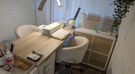 Chic nail salon setup at Luxe Beauty by Rosie, Lowestoft, England, GB with cozy chairs and nail polish display.