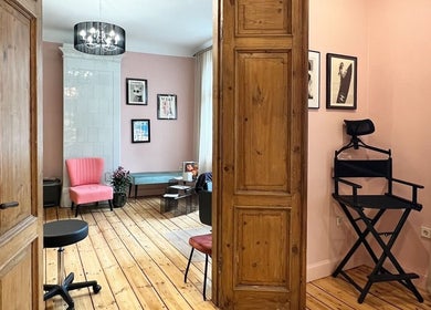 Elegant interior of Tresor Beauty in Rīga, LV featuring stylish furniture and decor highlighting its charm.