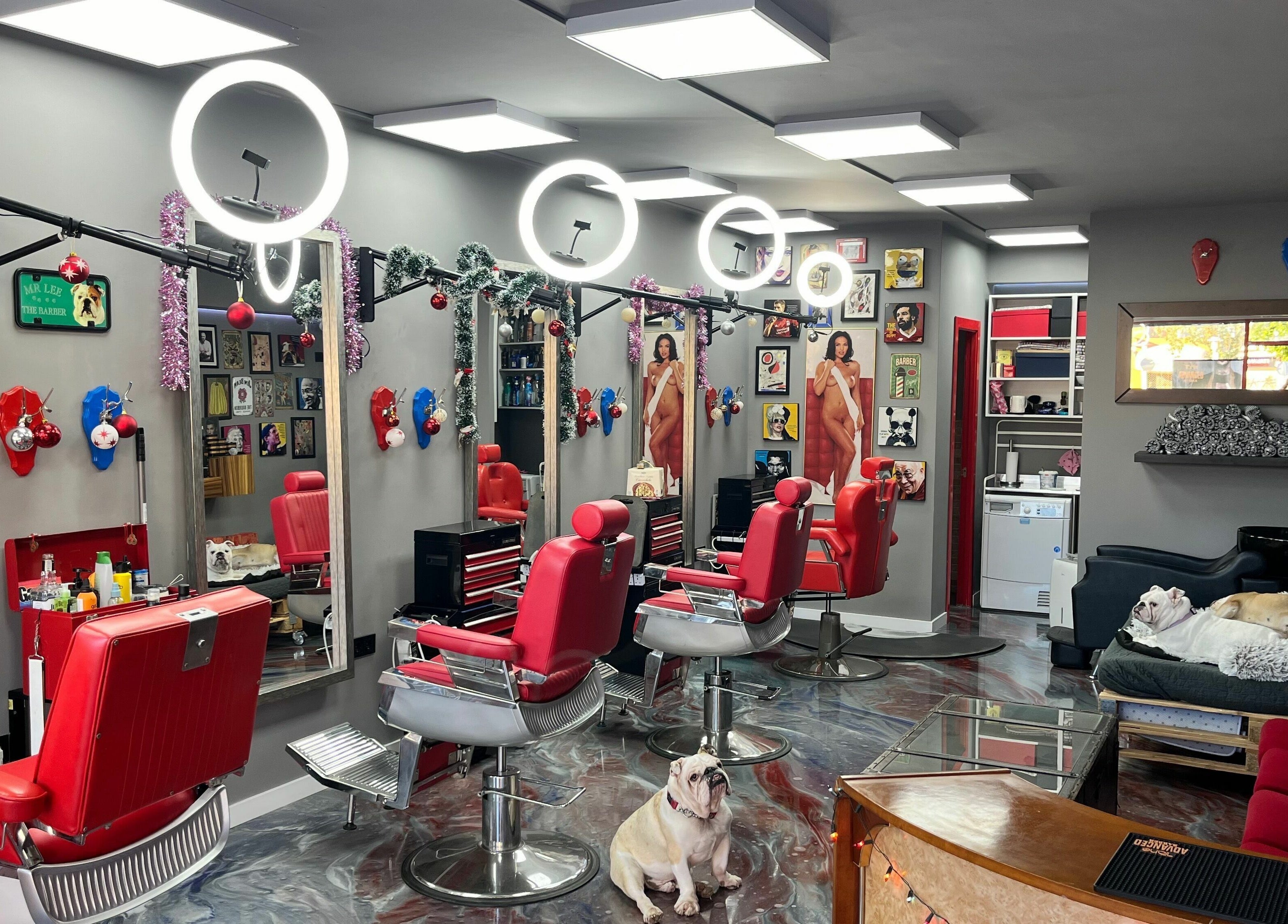 Inside Mr. Lee's Barbershop, Magaluf, Illes Balears, ES. Stylish chairs and decor.