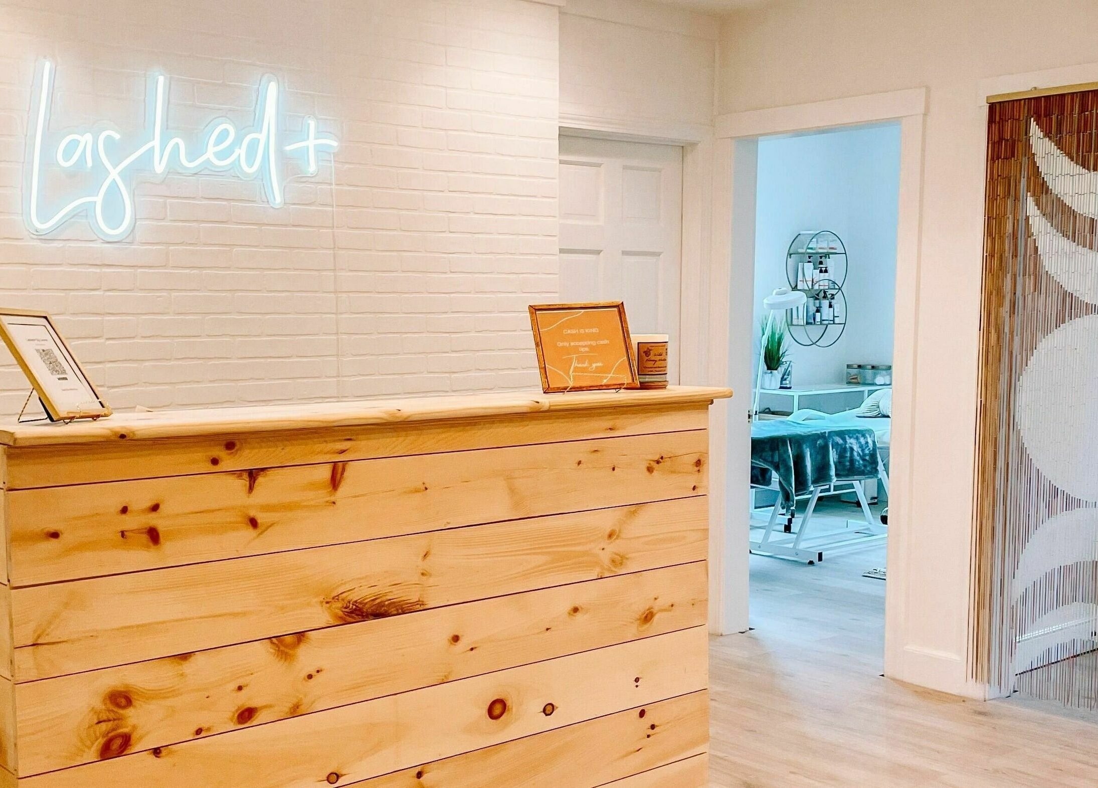 Welcoming reception at Katie Aesthetic Nurse at Lashed+, Norwell, Massachusetts, US with warm lighting.