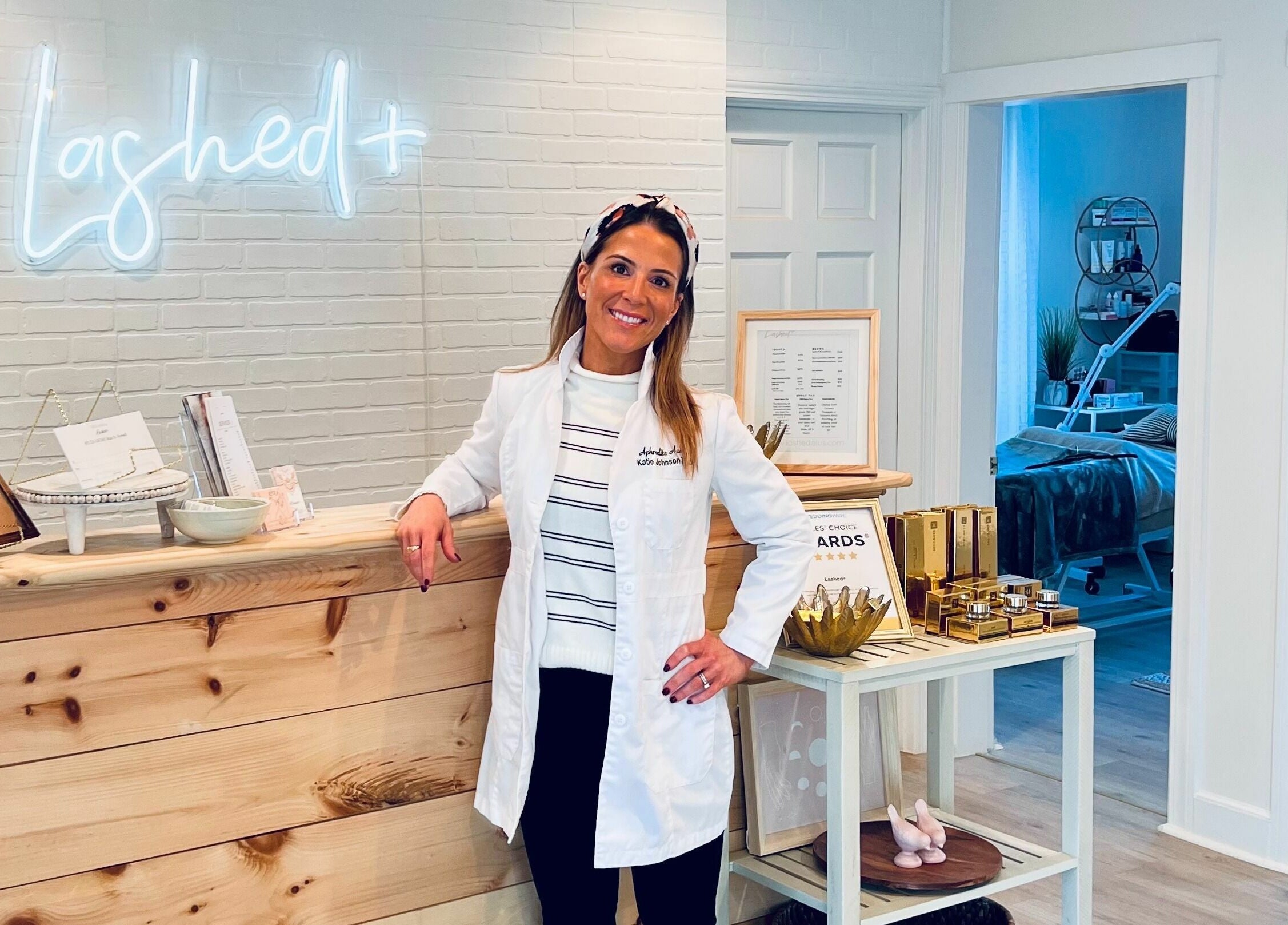Katie Aesthetic Nurse at Lashed+ reception in Norwell, Massachusetts, US, highlighting inviting decor.