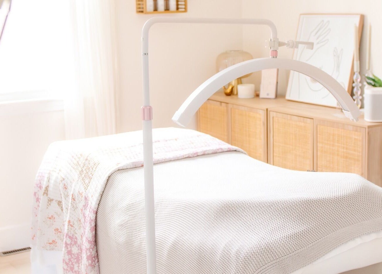 A serene treatment room at Lashed+ in Norwell, Massachusetts, US, featuring a comfortable bed and soft lighting.