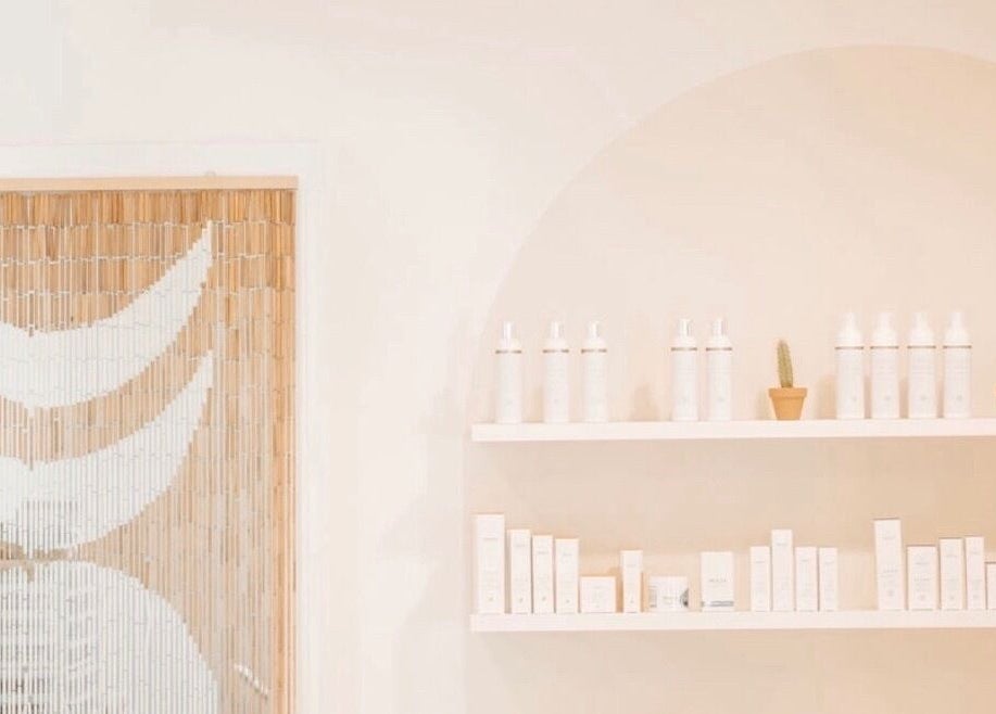 Elegant display of beauty products at Lashed+ in Norwell, Massachusetts, US with soothing decor.