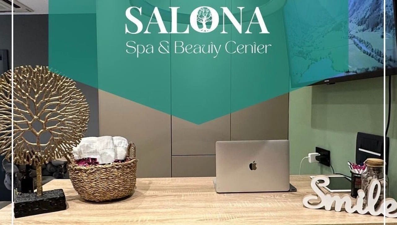 Reception area at Enjoy salona, Vogošća, Federacija Bosne I Hercegovine, BA with decor and laptop.