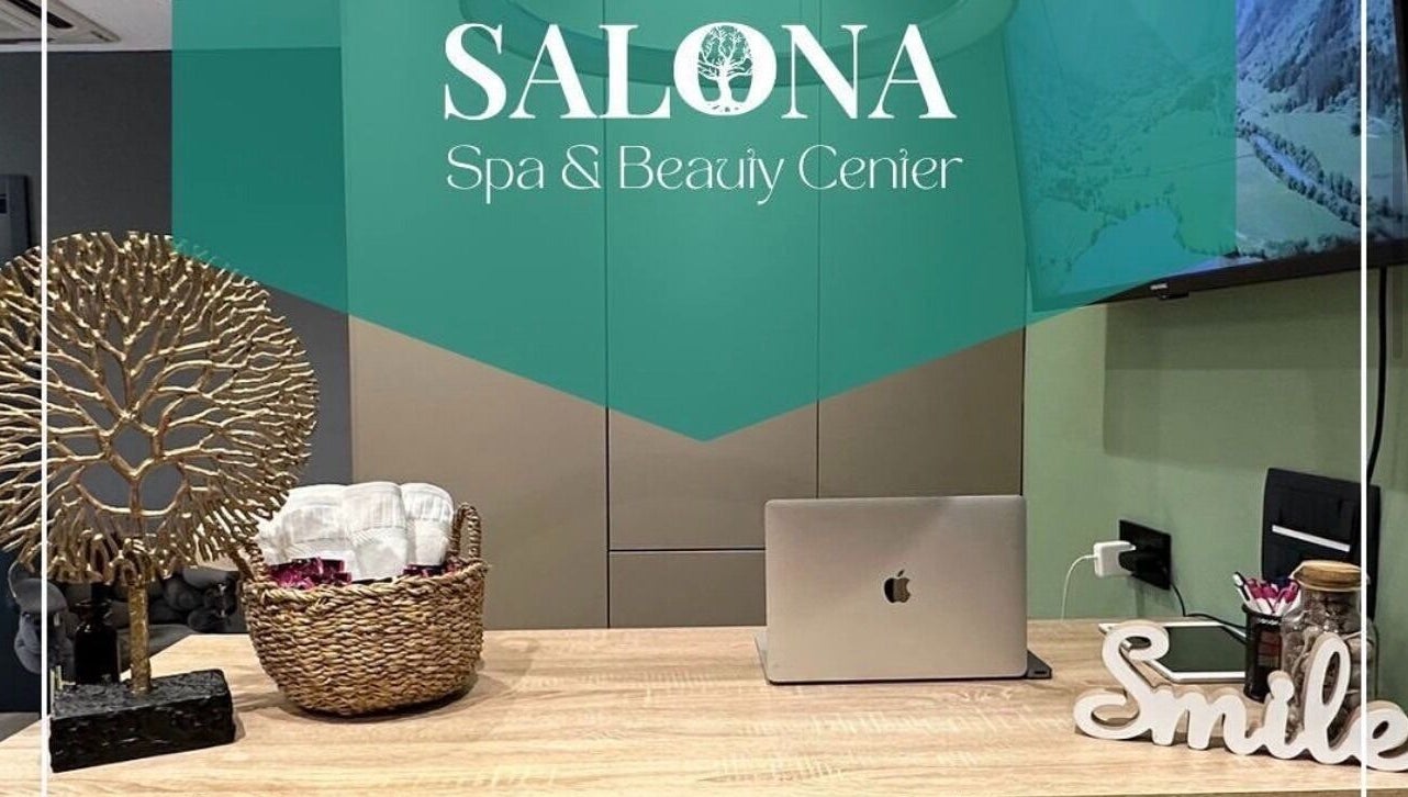 Reception area at Enjoy salona, Vogošća, Federacija Bosne I Hercegovine, BA with decor and laptop.