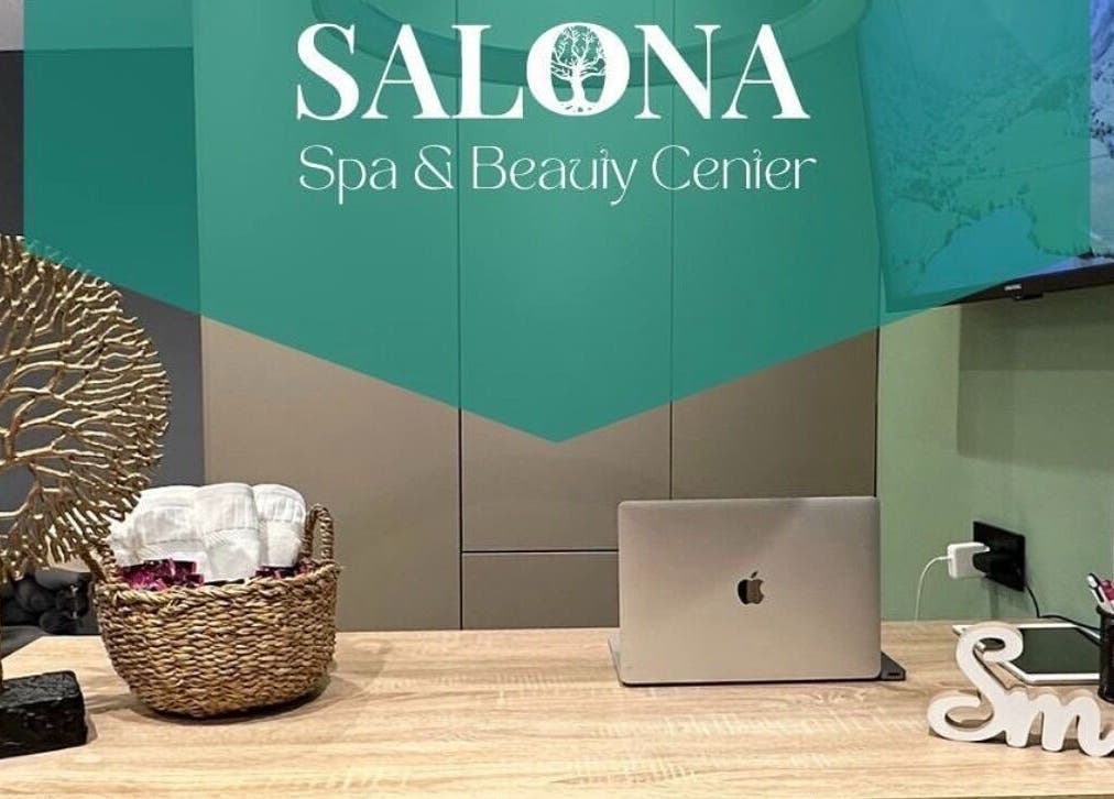 Reception area at Enjoy salona, Vogošća, Federacija Bosne I Hercegovine, BA with decor and laptop.