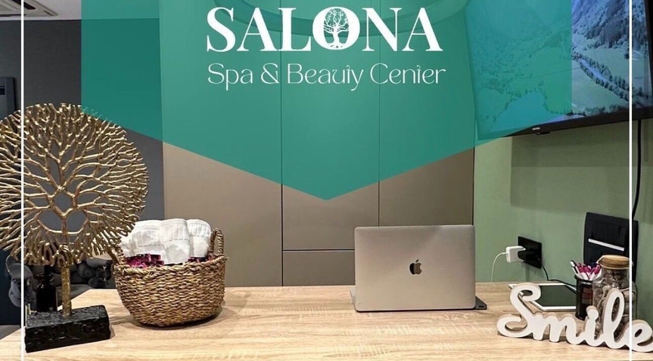 Reception area at Enjoy salona, Vogošća, Federacija Bosne I Hercegovine, BA with decor and laptop.