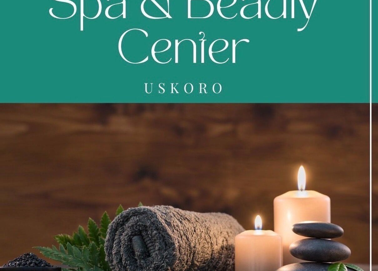 Cozy spa setup at Enjoy salona, Vogošća, Federacija Bosne I Hercegovine, BA with candles and towels.