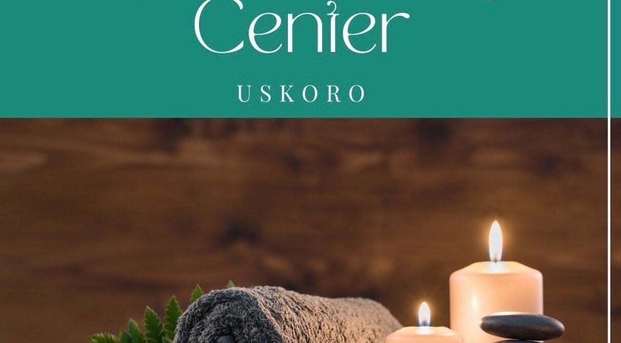 Cozy spa setup at Enjoy salona, Vogošća, Federacija Bosne I Hercegovine, BA with candles and towels.