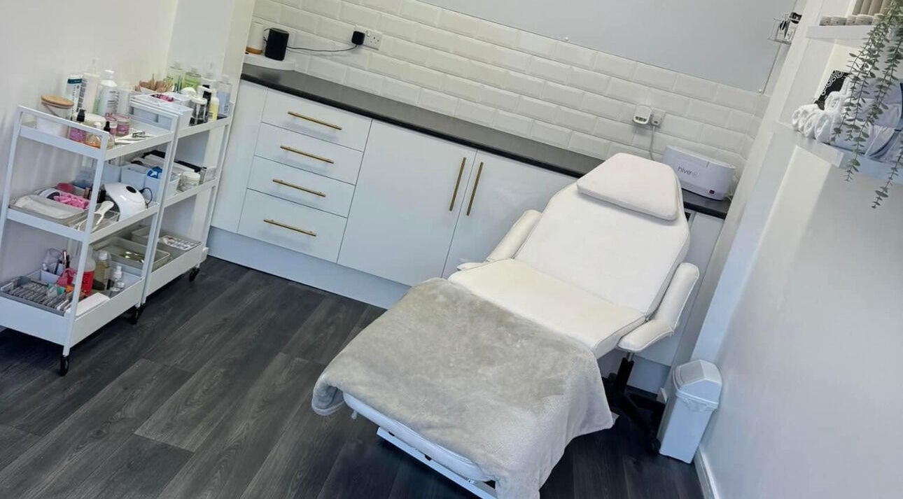 Relaxing beauty treatment room at House of Beauty, Bradford, England, GB with clean white decor and equipment.