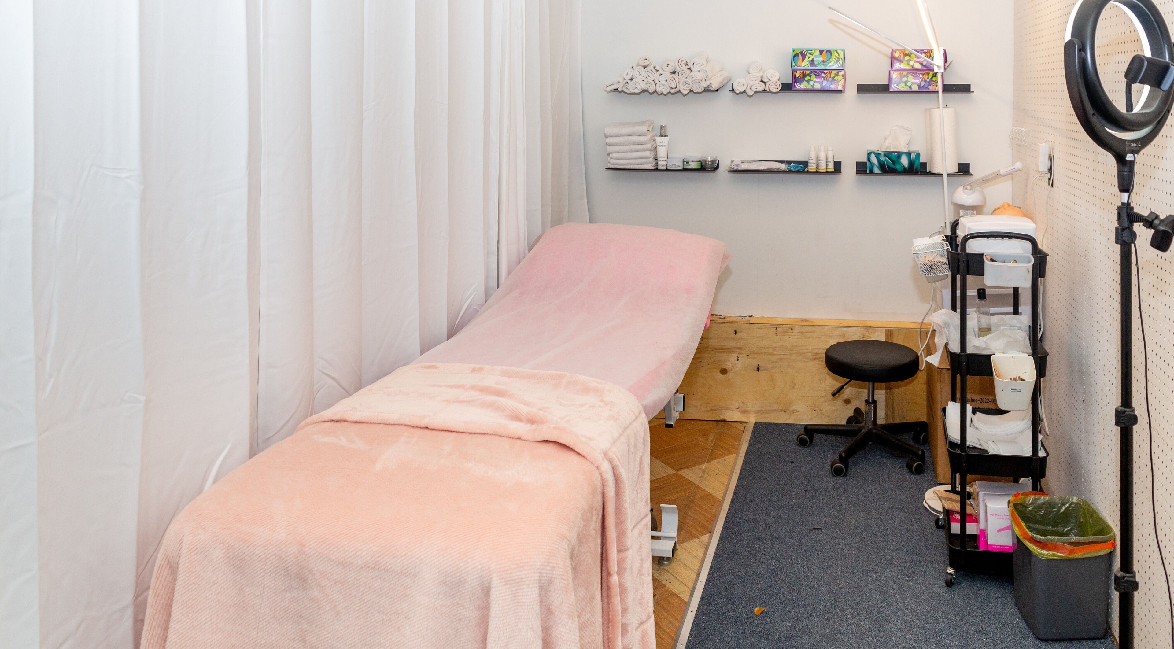 Cozy treatment room at Chic Lash Boutique Commercial Dr, Vancouver, British Columbia, CA featuring a soft pink bed.