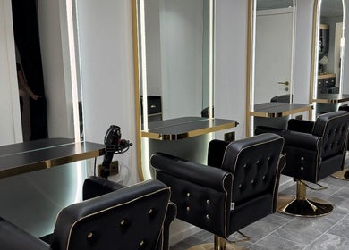 Elegant salon chairs and mirrors at The Salon Box, Brentwood, England, GB.