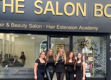 Friendly staff outside The Salon Box in Brentwood, England, GB, showcasing a welcoming entrance.