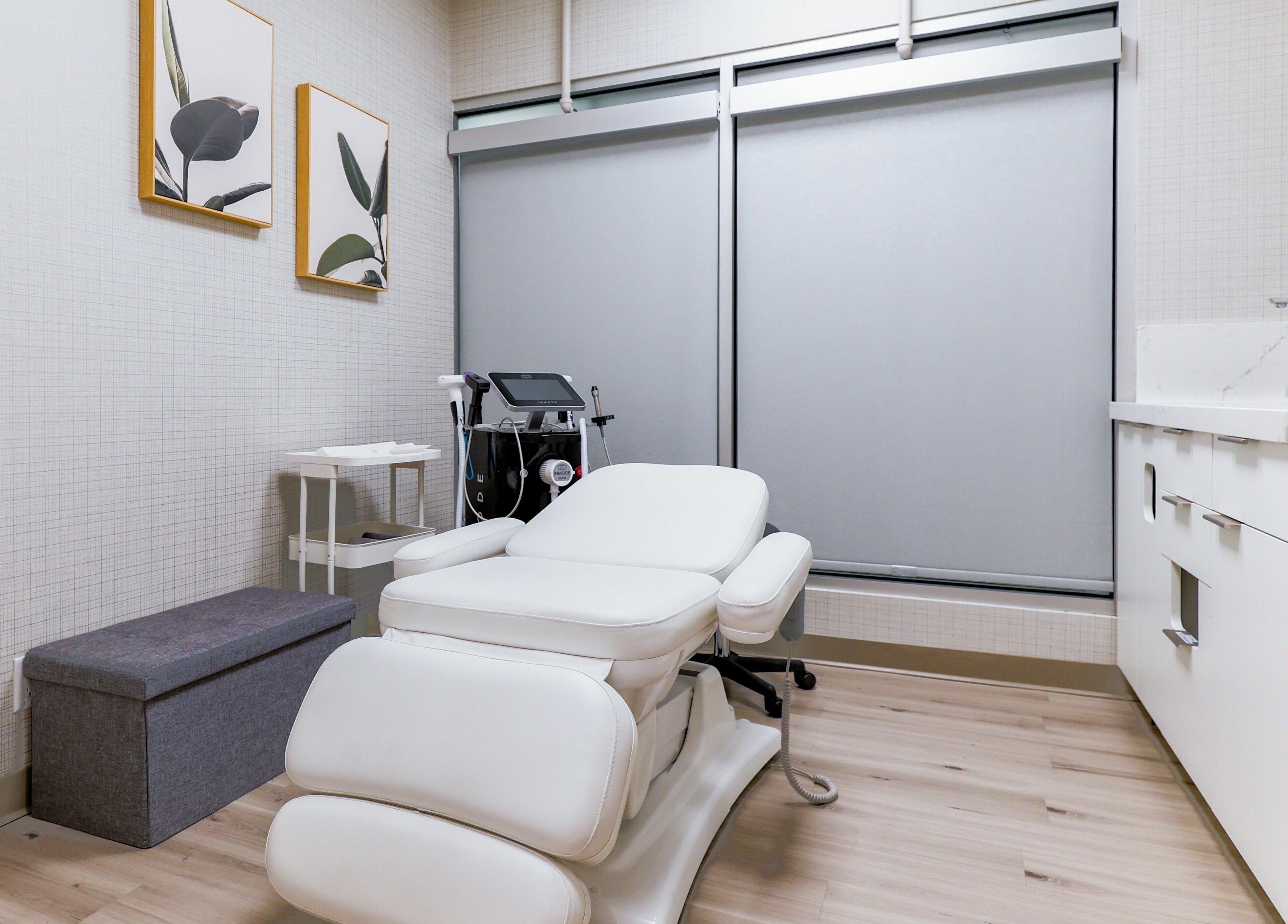Modern treatment room at Eye Spa Aesthetics, Calgary, Alberta, CA with a relaxing white chair and elegant decor.