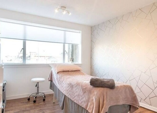 Tranquil treatment room at Lady A Clinic, Ayr, Scotland, GB with cozy decor and natural light.