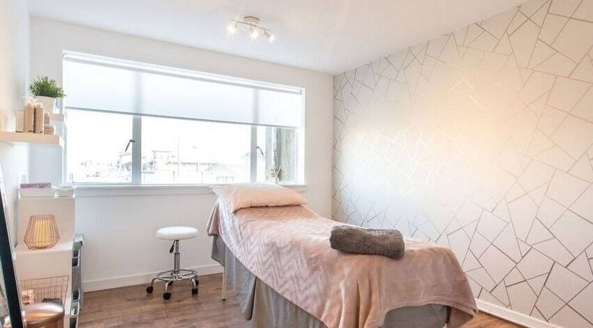 Tranquil treatment room at Lady A Clinic, Ayr, Scotland, GB with cozy decor and natural light.