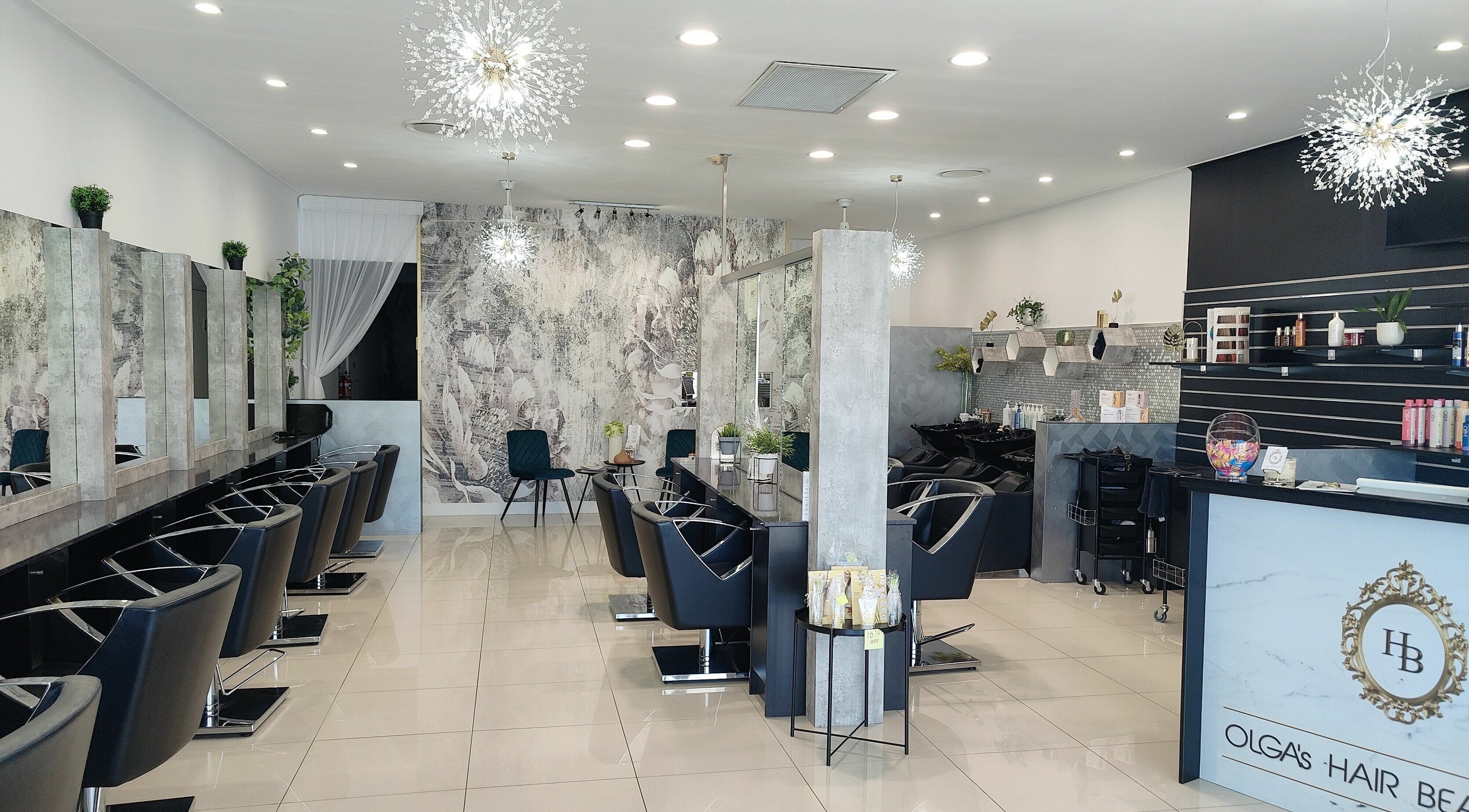 Modern interior of Olga’s Hair Beautique, Nerang, Queensland, AU, showcasing stylish salon chairs and decor.