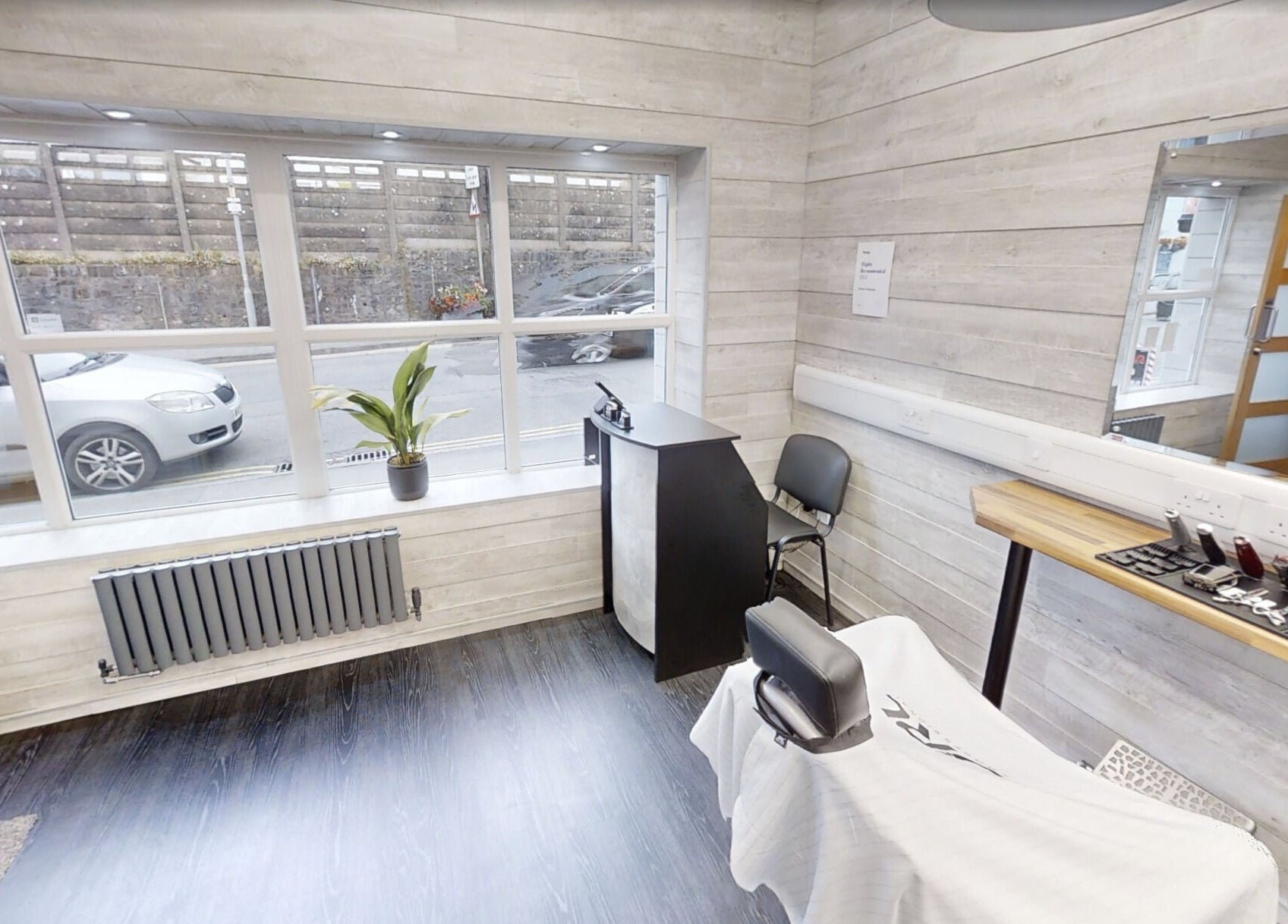 Cozy barber station at Studio 4 Barbers, Saundersfoot, Wales, GB with stylish decor and natural light.