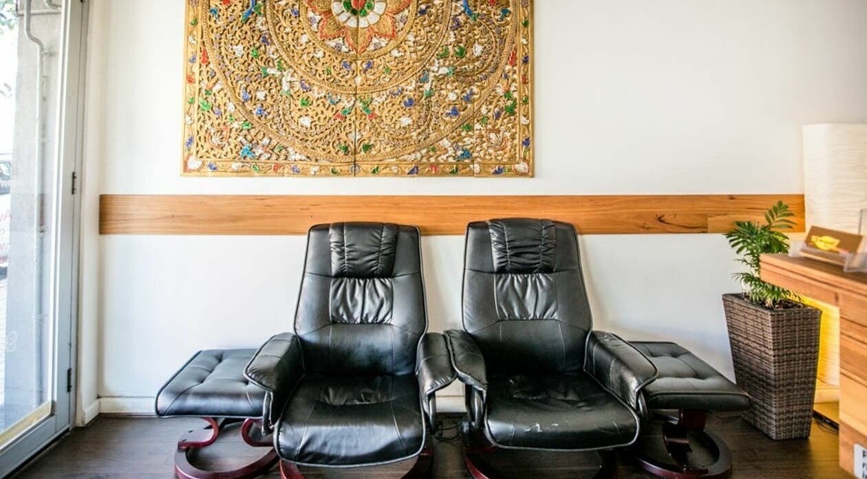 Relaxing massage chairs at Elwood Thai Massage, Melbourne, Victoria, AU with ornate wall art.