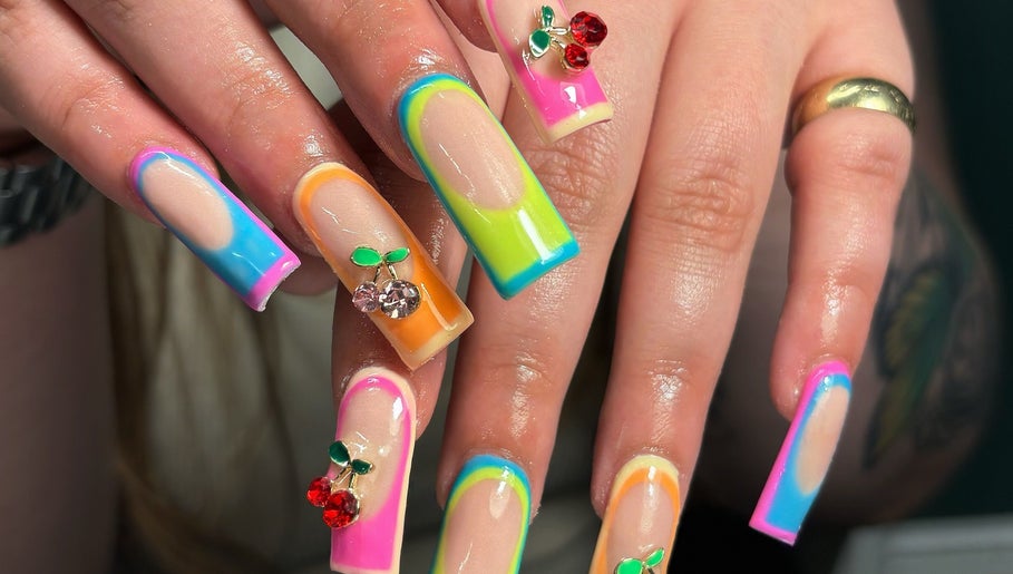 Colorful nail designs with fruit gems at Hacrylicz, Seaton Delaval, England, GB.