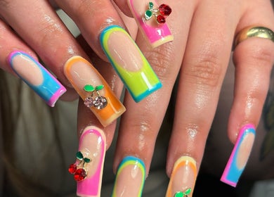 Colorful nail designs with fruit gems at Hacrylicz, Seaton Delaval, England, GB.