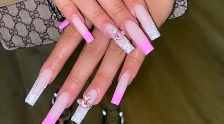 Elegant pink and glitter nails from Hacrylicz in Seaton Delaval, England, GB showcase exquisite nail artistry.