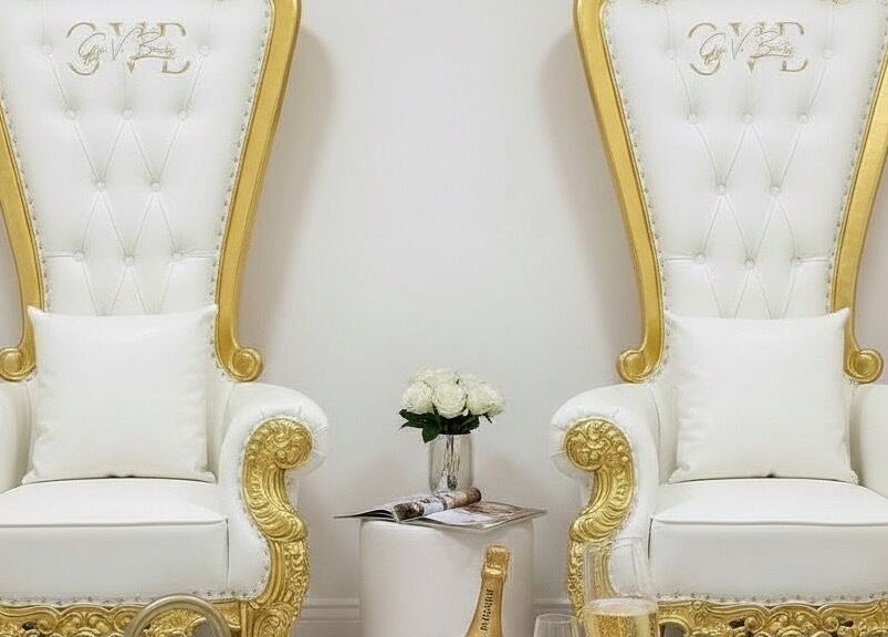 Elegant white and gold salon chairs at Gigi Vi Ltd, Plymouth, England, GB, offering luxury beauty services.