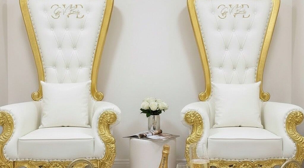 Elegant white and gold salon chairs at Gigi Vi Ltd, Plymouth, England, GB, offering luxury beauty services.