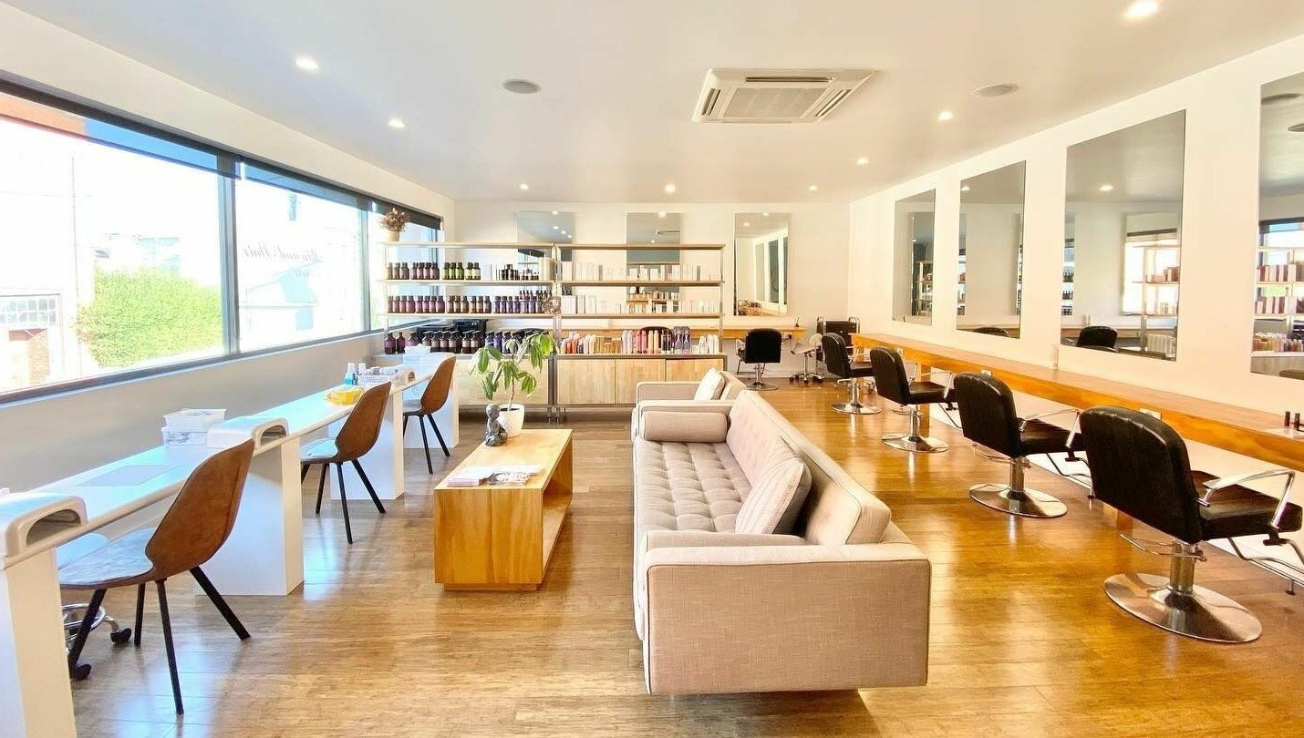 Bright, modern interior of Essence Skin and Body, Launceston, Tasmania, AU featuring salon chairs and mirrors.