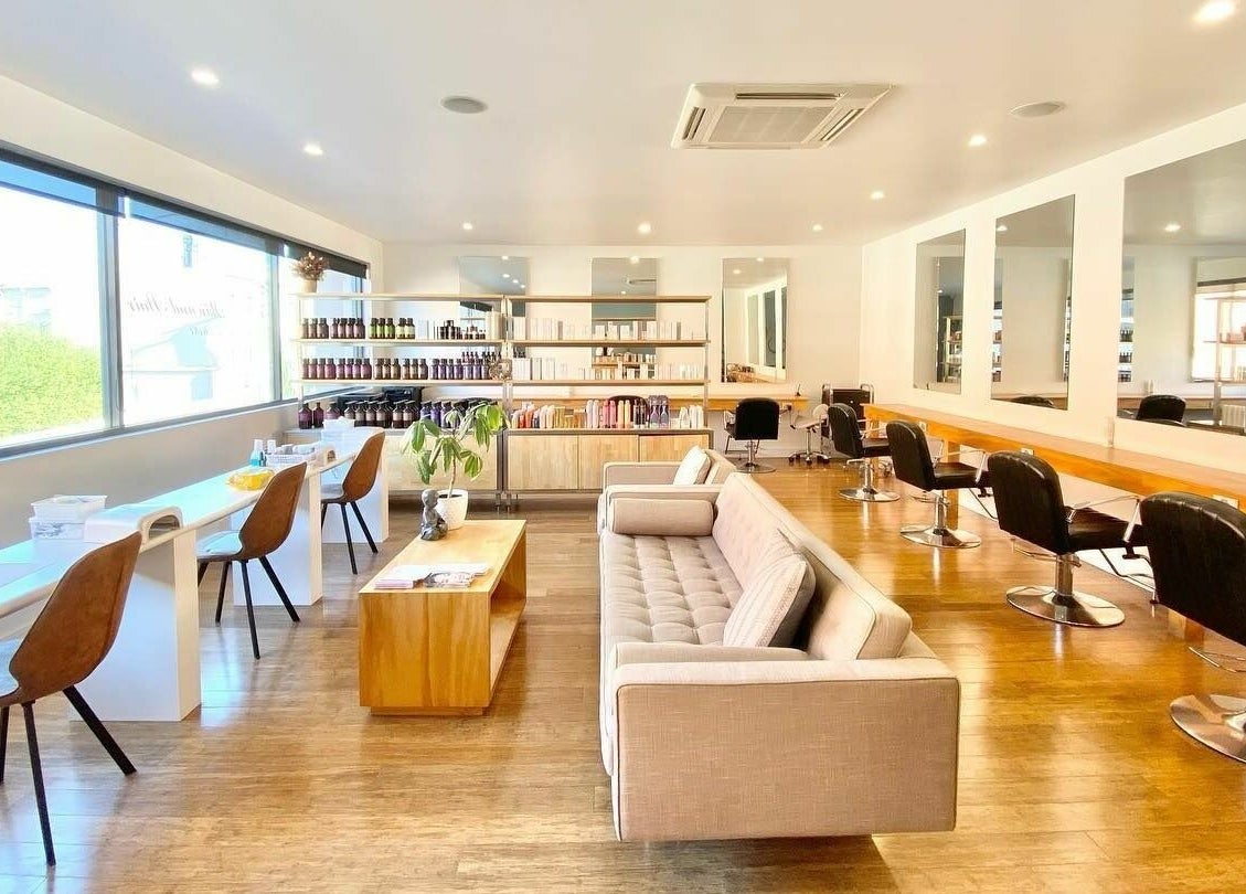Bright, modern interior of Essence Skin and Body, Launceston, Tasmania, AU featuring salon chairs and mirrors.