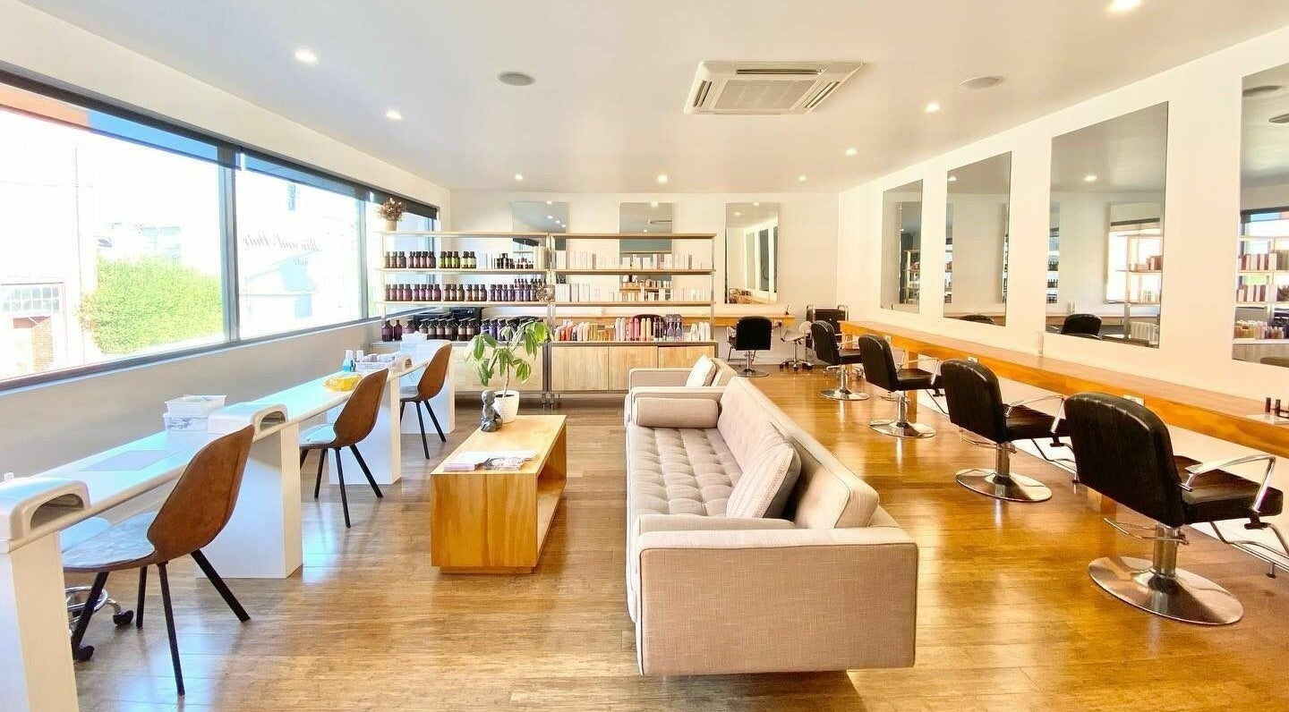 Bright, modern interior of Essence Skin and Body, Launceston, Tasmania, AU featuring salon chairs and mirrors.
