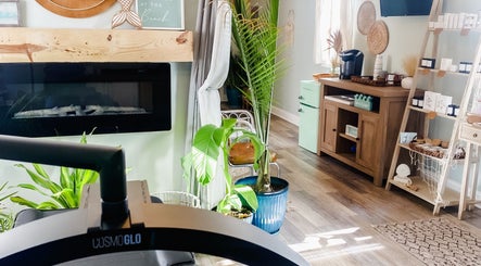 Inviting interior of Sea Salt Esthetics in Thor, Iowa, US with plants and cozy decor.