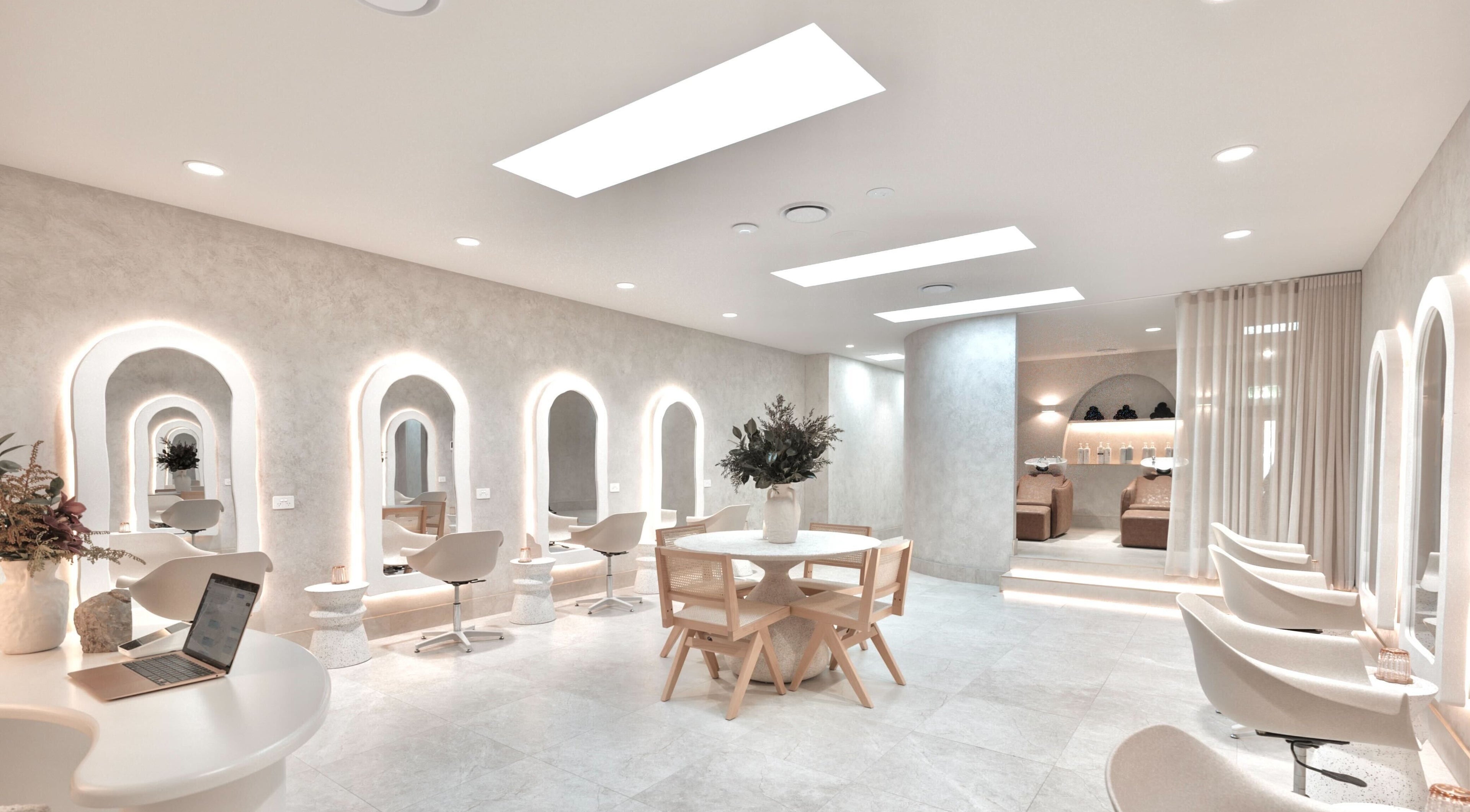 Luxurious salon interior at Muse By Jessica Taylor, Melbourne, Victoria, AU with chic seating and soft lighting.