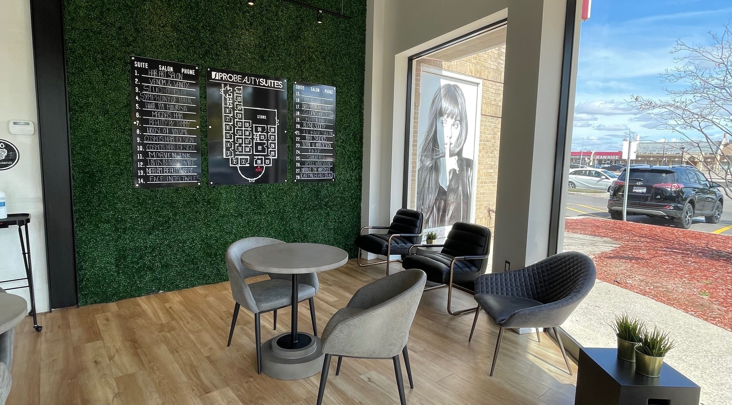 Modern waiting area at Gigi Sugar Studio in Mississauga, Ontario, CA with stylish chairs and wall decor.