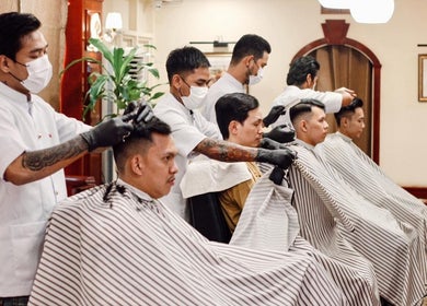 Fraser Barbershop - Botahtaung barbers styling hair in Yangon, Yangon Region, MM.