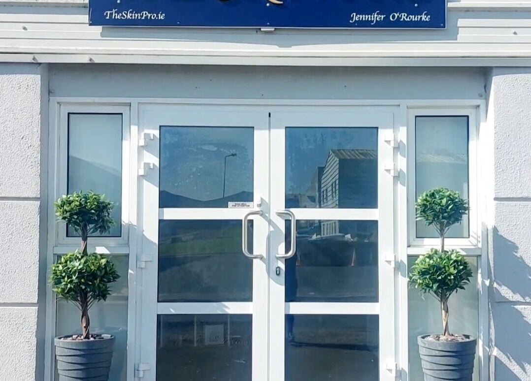 Front entrance of The Skin Pro .ie, Waterford, County Waterford, IE with twin potted plants.
