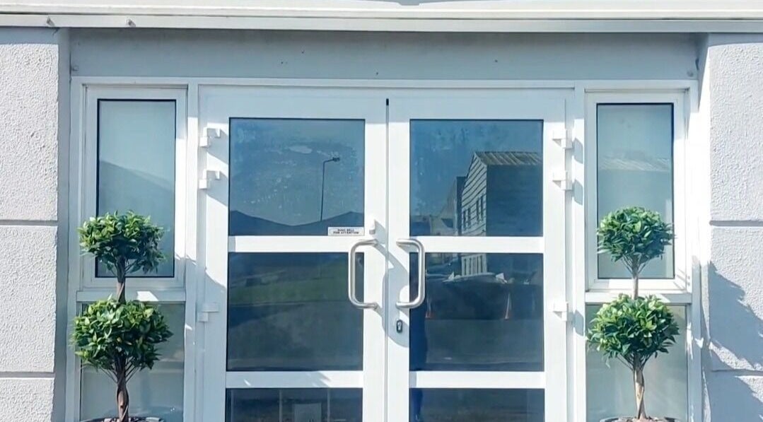 Front entrance of The Skin Pro .ie, Waterford, County Waterford, IE with twin potted plants.