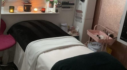 Gemmy Gorgeous treatment room in Leeds, England, GB features relaxing candles and plush bed.