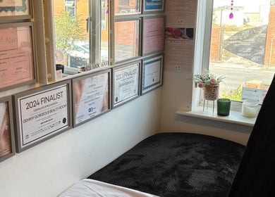 Certificates and awards on wall at Gemmy Gorgeous, Leeds, England, GB, highlighting salon accomplishments.
