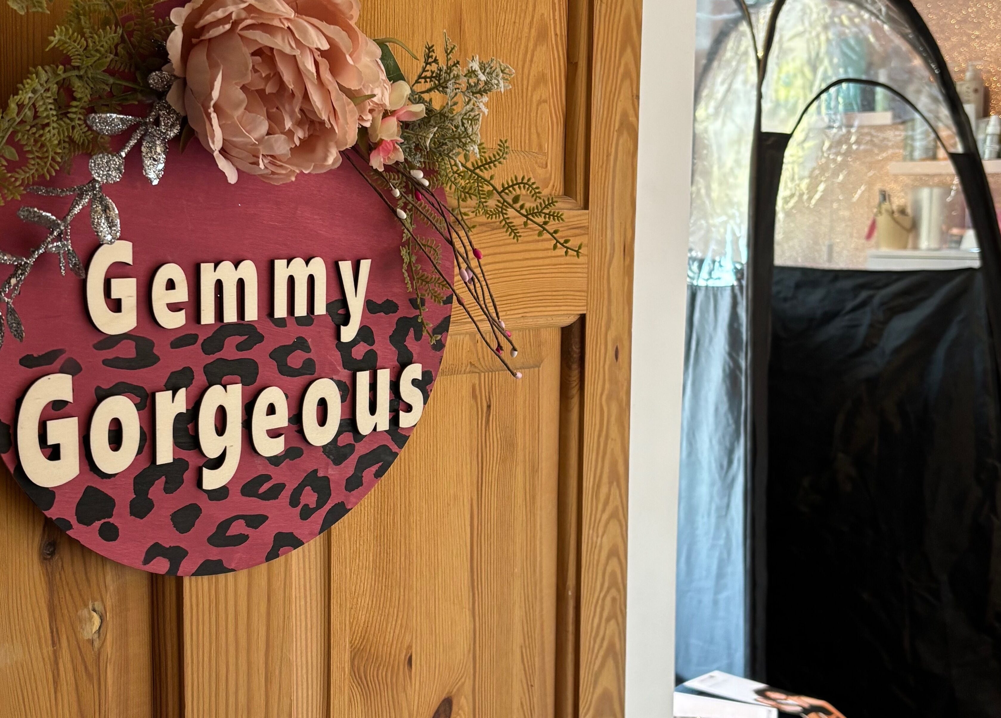 Gemmy Gorgeous venue entrance in Leeds, England with floral door sign and beauty station.