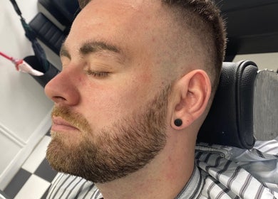 Close-up of a man with a fresh haircut at Coal House Cuts, Upminster, England, GB.