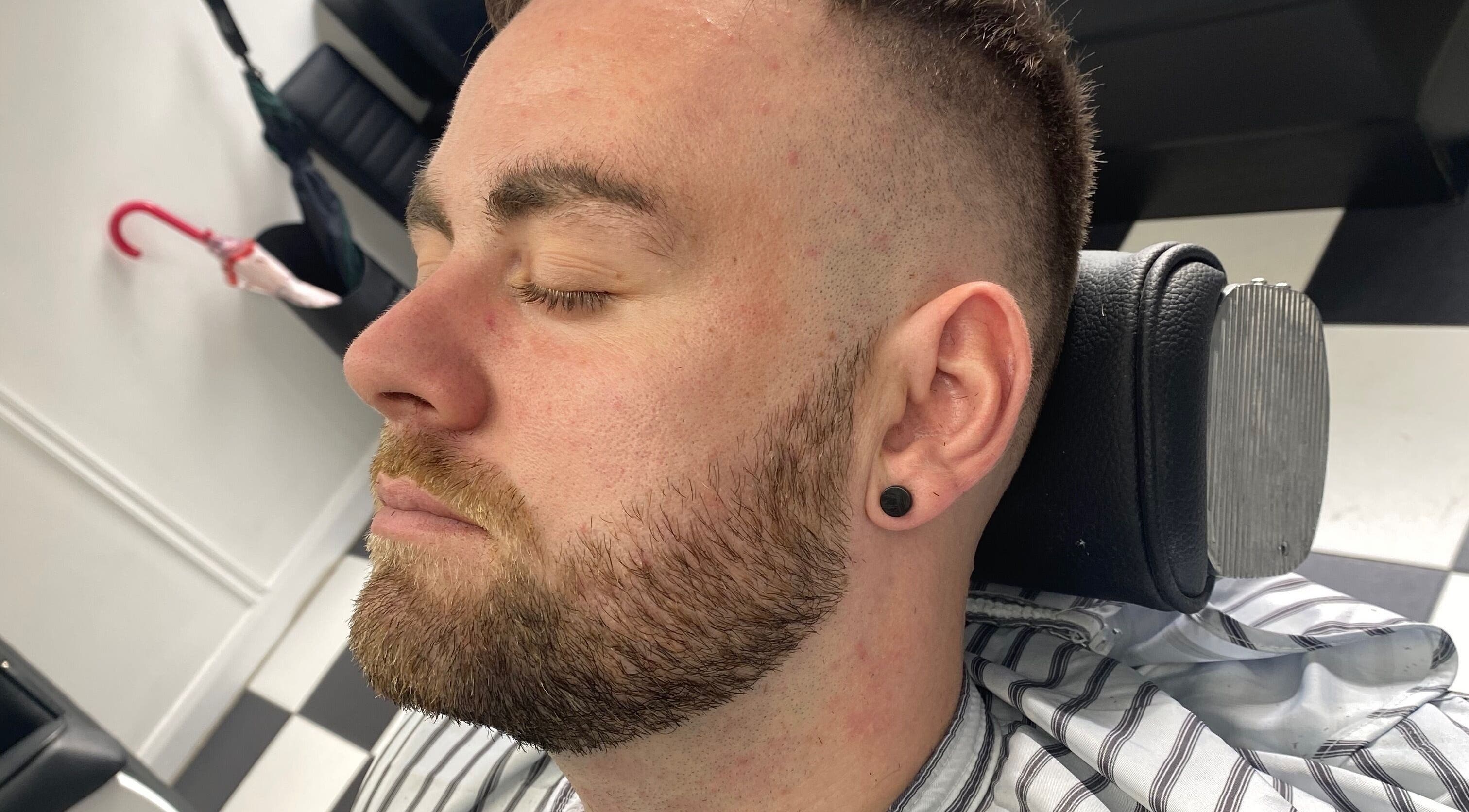 Close-up of a man with a fresh haircut at Coal House Cuts, Upminster, England, GB.