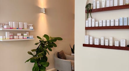 Product shelves at Canberra Day Spa, Canberra, AU, with lush plant decorations.