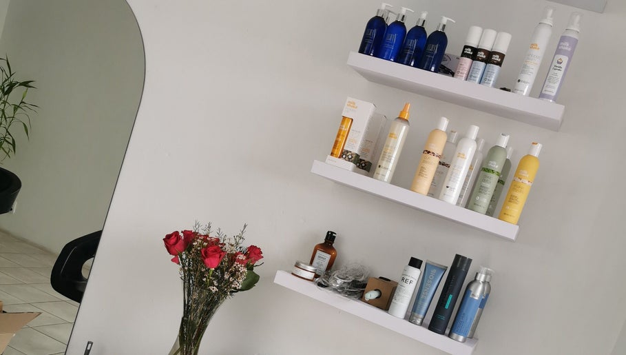Product shelves at The Covered Pearl in Cape Town, Western Cape, ZA featuring hair care and wellness items.