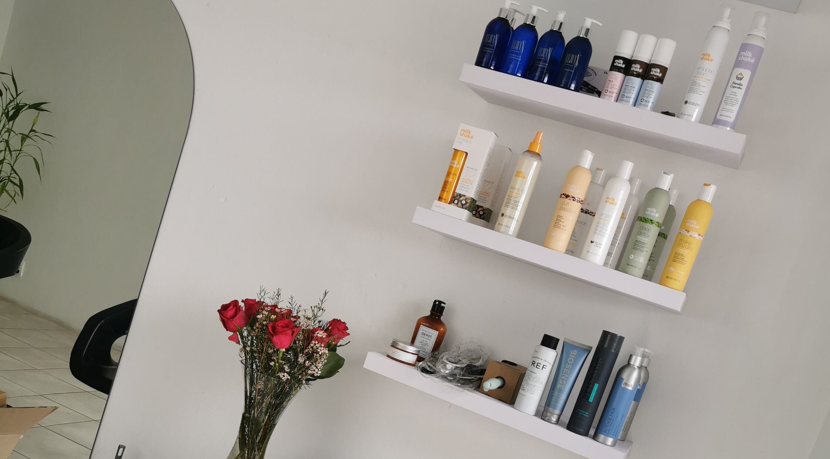 Product shelves at The Covered Pearl in Cape Town, Western Cape, ZA featuring hair care and wellness items.
