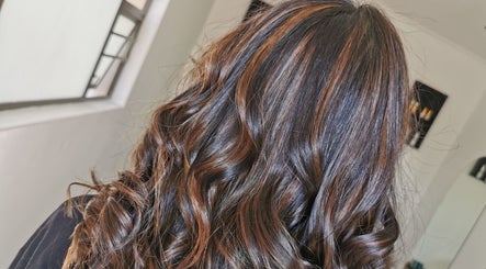 Glossy, curled hair styled at The Covered Pearl in Cape Town, Western Cape, ZA. Perfect for glam makeovers.