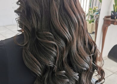 Elegant cascade of styled hair at The Covered Pearl, Cape Town, Western Cape, ZA.
