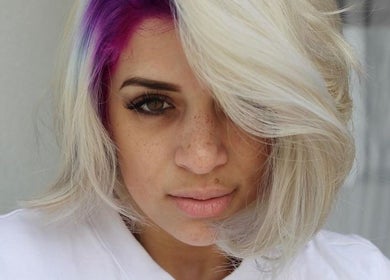 Stylish woman with purple highlights at The Covered Pearl, Cape Town, Western Cape, ZA.