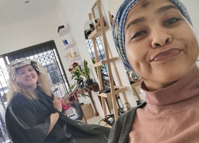 Clients enjoying hair treatments at The Covered Pearl, Cape Town, Western Cape, ZA.